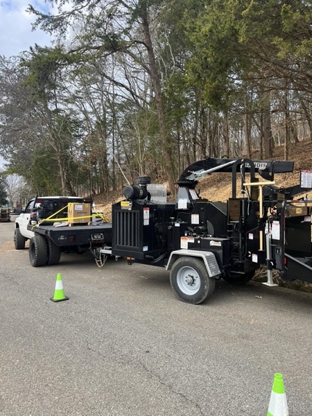 The Elite Tree Service chipper and truck set up on site